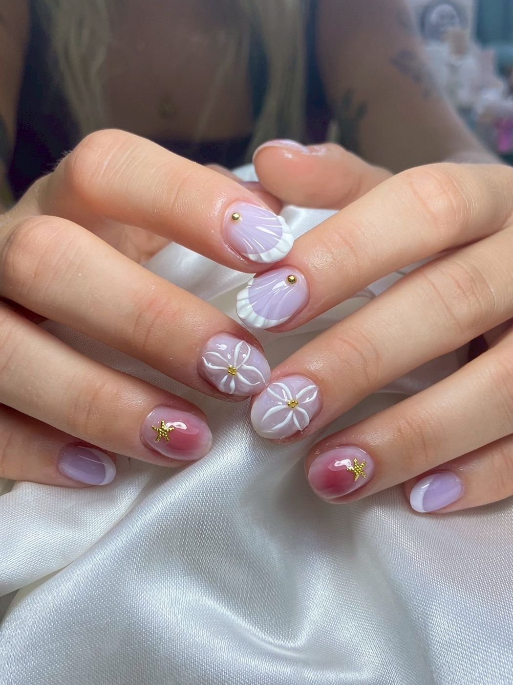 Lilac nails with 3D shell and flower art