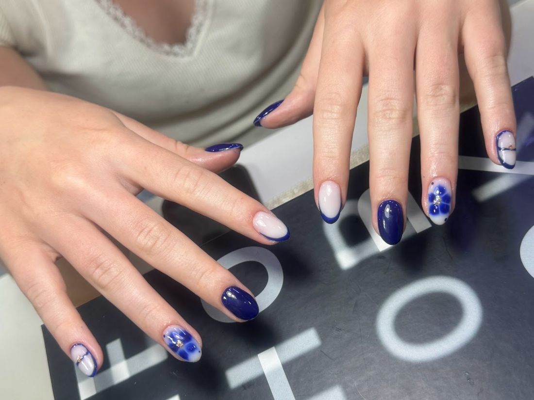 Navy nails with blue floral accents